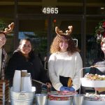 carrier law team members having fun during the cookie and cocoa drive-by