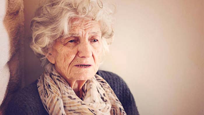 distressed elderly woman worried about inflation